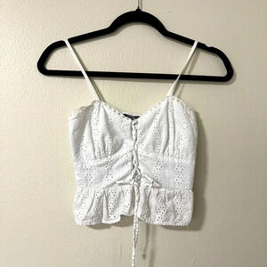 Wild fable size XXS White eyelet crop top adjustable straps and tie in the front